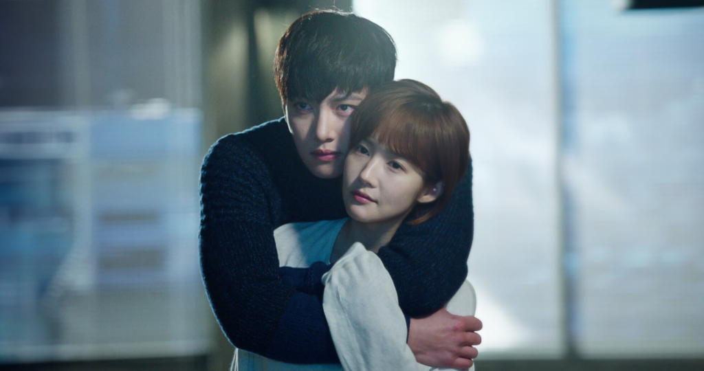 Uma imagem promocional do dorama Healer com os atores principais, Ji Chang-wook e Park Min-young, vestidos como seus personagens, em um ambiente que sugere ação e romance.